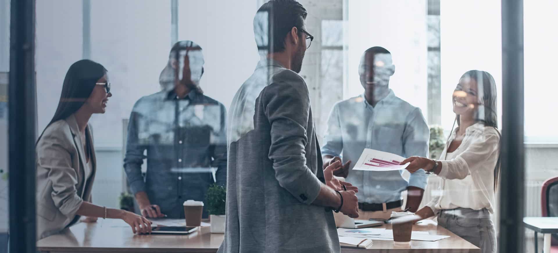 Coworkers Shaking Hands in Office